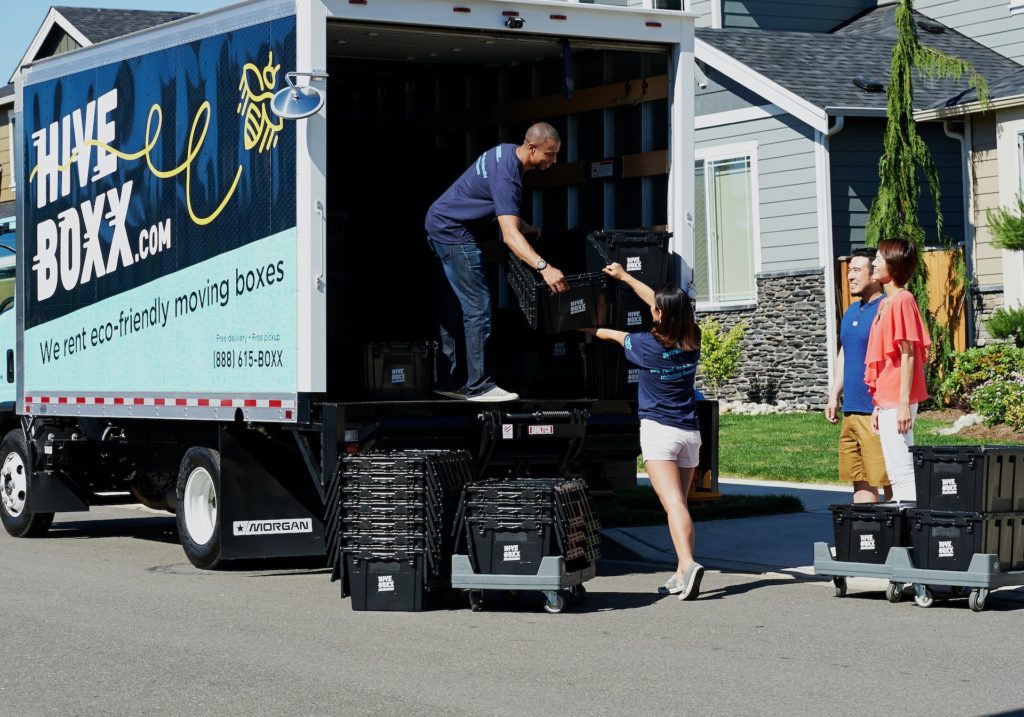 Movers putting boxes inside the truck