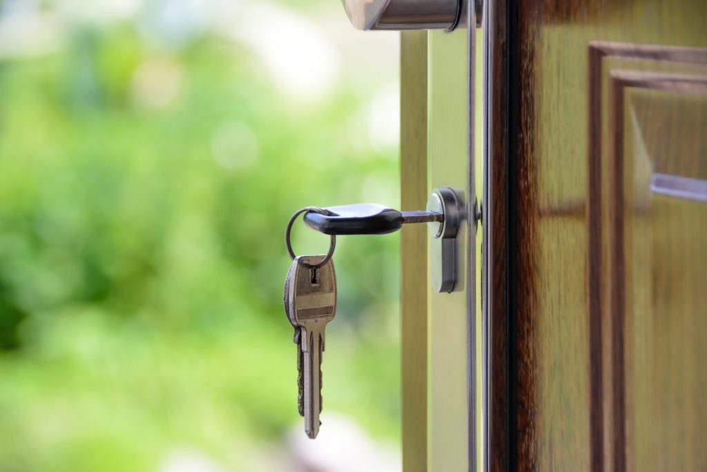 A key being put into a door lock